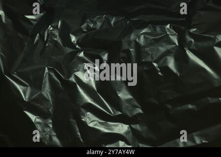 close up of black plastic garbage bag texture and background Stock Photo
