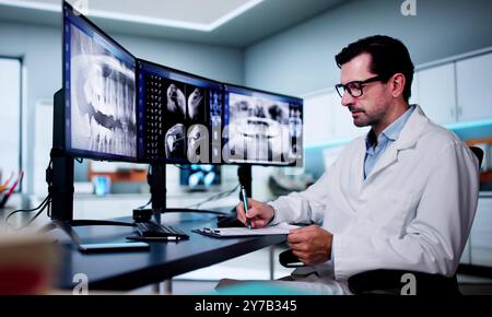 Radiologist Dentist Using X Ray Software On Desktop Computer Stock Photo