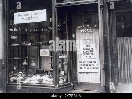 View of a perfume shop in Vienna with posted signs certifying that the enterprise is an Aryan firm. The German signs read, 'Floris Perfume Shop, Aryan Firm;' 'We refuse to serve Jewish customers;' and 'Fioris soaps, with the stamp of an Aryan firm.'  Such were the ugly clues of the catastrophe to come. Stock Photo