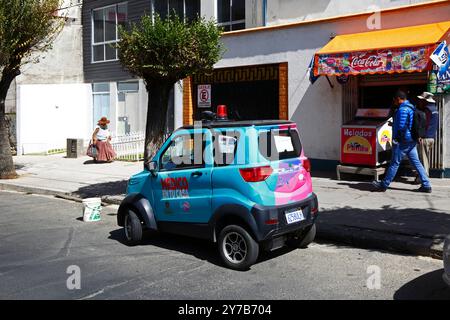 A small electric car made by Quantum Motors that belongs to the La Paz Municipal Government and is part of the 'Medico en tu Casa' project to provide medical services and doctors visits to the homes of people who can't visit hospitals or clinics. The services started in April 2023. Quantum Motors is a company based in Cochabamba that has been producing small battery powered vehicles, assembled from parts imported from mainly China, since 2019. Stock Photo