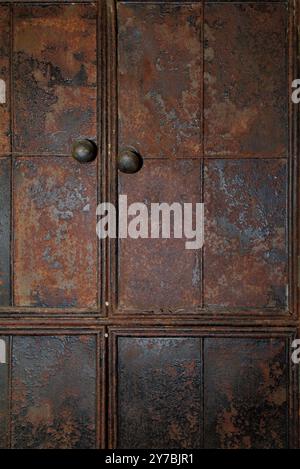 Old, Worn,Weathered Rusty Cast Iron Doors Of A Kitchen Cupboard, Highcliffe Castle, UK Stock Photo