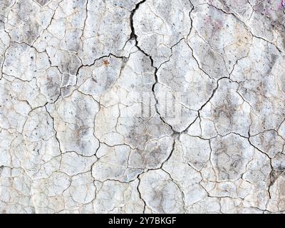 abstract line pattern on white painted part of conrete with cracks Stock Photo