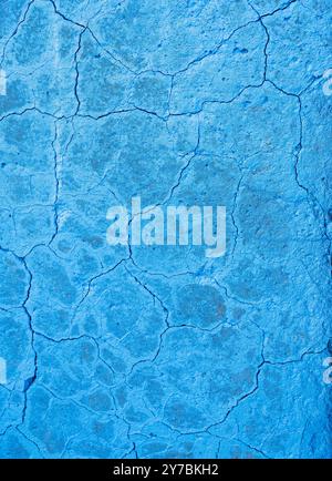 abstract line pattern on blue painted part of conrete with cracks Stock Photo