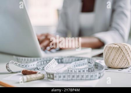Close-up of woman using laptop while working in design studio Stock Photo