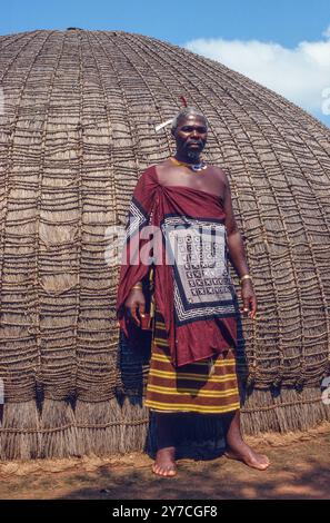 SWAZI MEDICINE MAN OUTSIDE HIS VILLAGE HUT, SWAZILAND Stock Photo