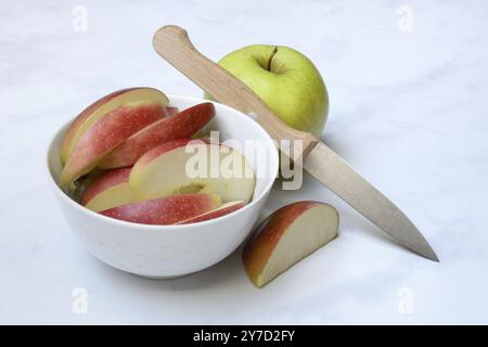 Apple and apple slices in peel, sliced apple with knife Stock Photo