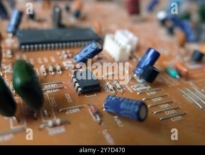 Analog integrated Circuit or IC on the center of the electronic circuit board. Selected focus. Stock Photo