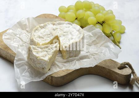 French Camembert, cheese on a wooden board Stock Photo