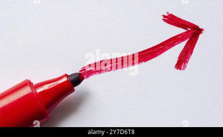Marker and red arrow on white background Stock Photo