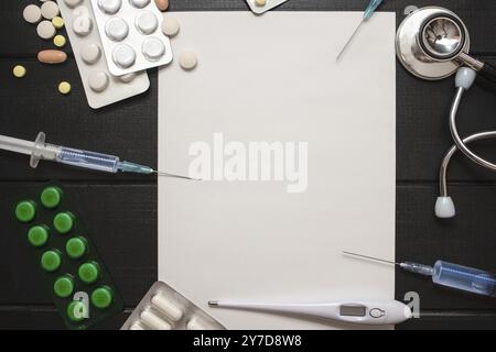 Medication prescription with pills and stethoscope lies on wooden table. Tablet or drug. Medicine and healthy concept. Copy space for text. Close-up. Stock Photo