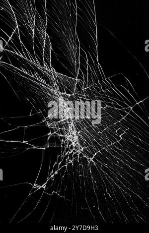 Cracked broken glass screen protection of smartphone or tablet. Damaged screen effect Stock Photo