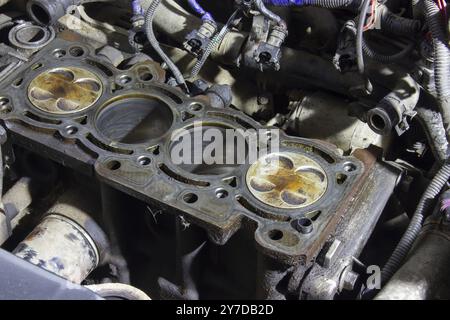 4 cylinders of the car engine in oil, the engine disassembled during repair Stock Photo