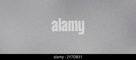 Abstract grainy texture on a gray surface suitable for backgrounds or overlays Stock Photo