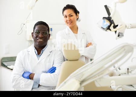 Two successful professional dentists in modern dental office Stock Photo