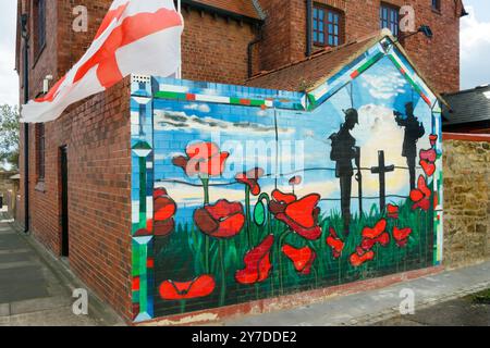 painted wall art urban mural  of WW1 poppies soldier and george england flag  in sunderland tyne & wear UKs corner of a foreign field Stock Photo