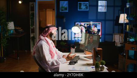 Muslim man in teleconference meeting session with therapist, asking for advice, feeling down. Remotely working Middle Eastern company executive in internet consultation with psychologist Stock Photo