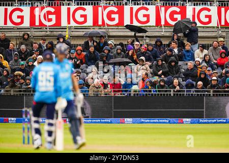 Bristol, UK, 29 September 2024. A general view of fans as they put up umbrellas in the rain during the Fifth Metro Bank One Day International match between England and Australia. Credit: Robbie Stephenson/Gloucestershire Cricket/Alamy Live News Stock Photo