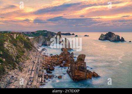 Sunset at the rock formation of Los Urros de Liencres, part of a fabulous Geology Nature Park in Cantabria in northwestern Spain. Stock Photo