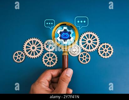 AI searching tools, robot job business service, development and management technology concept. Chat bot icon in magnifying glass lens in hand decorati Stock Photo