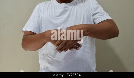 Young man learning sign language, communication for deaf Stock Photo