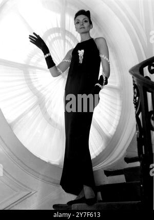 Paris: The most dramatic of the collection of black evening dresses, shown  by Givenchy in his Autumn Winter 1968/69 collection, has sparkling shoulder  straps winding down along the arms. High draped front