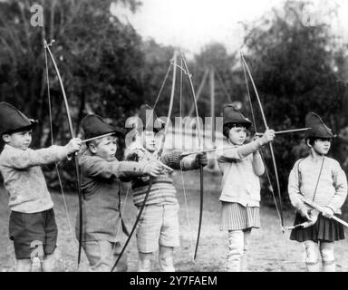 Prince Philip goes 'Hunting': In this picture, made about 1929, during archery practice at the MacJannet School at St Cloud, France, is a boy (second from left) destined to become the present Duke of Edinburgh, husband of Queen Elizabeth.  From left to right are:  Jacques de Bourbon; the Prince; Teddy Culbert; Martha Robertson; and Princess Anne of Bourbon-Parma (now the wife of Prince Michael of Roumania).   The Prince attended the school for three years, from the age of eight to the age of eleven.  (18th February 1952) Stock Photo