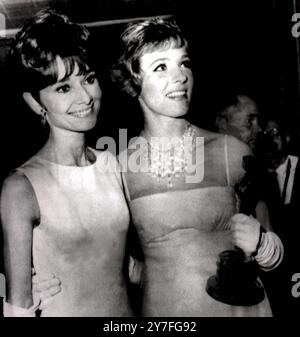 Audrey Hepburn and Julie Andrews Awards Presentation: Santa Monica, California: Actress Audrey Hepburn (left) and Julie Andrews are pictured on April 5 During the 37 annual Academy Awards. Julie is holding the Oscar for best performance by an actress for her role in the  Disney film ''Mary Poppins''  10  April 1965 Stock Photo