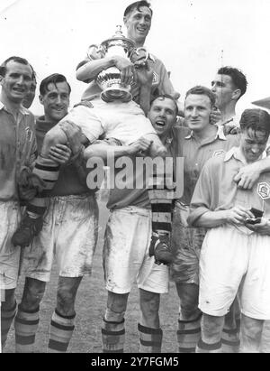 1950 FA Cup Final  Arsenal captain Joe Mercer holds the Football Association cup he had just received from the King, after Arsenal had defeated Liverpool by two goals to one in the cup final.  29th April 1950. Stock Photo