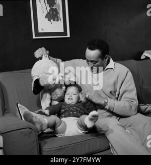 Ray Ellington, 1915-1985, at home in London with his son Lance by  wife Anita West who was the second female presenter of Blue Peter and son Lance, born 1957.   After 1958 Stock Photo