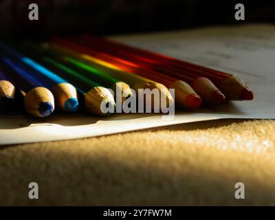 Sunny Colored Pencils for School On Paper Stock Photo