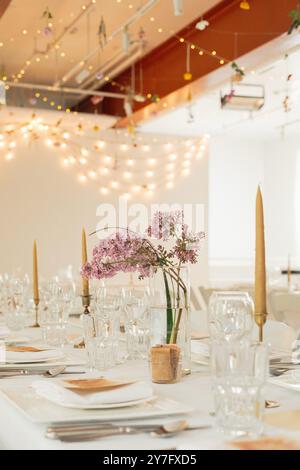Spring wedding decor with purple lilac centre pieces Stock Photo