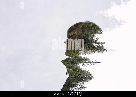 Double Exposure Silhouette with Forest Overlay Stock Photo