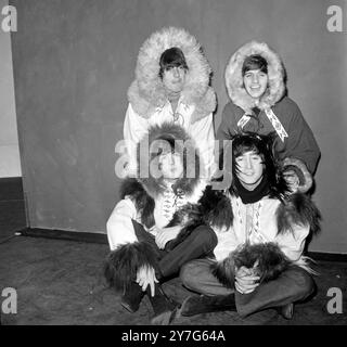 23 DECEMBER 1964 The Beatles dressed in winter clothing during rehearsals for their Christmas show at the Odeon cinema, Hammersmith,  London, England. Stock Photo