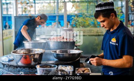 The concept of oriental cuisine. Assorted Uzbek food set, pilaf, samsa, lagman, manta, shurpa central asia food. Homemade Uzbek pilaf or plov from lam Stock Photo