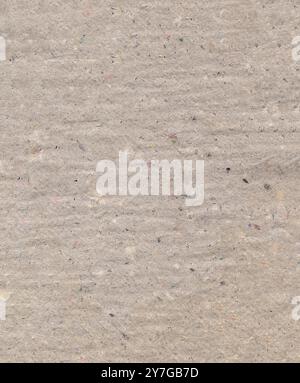 Pressed uneven dense gray cardboard with debris particles Stock Photo
