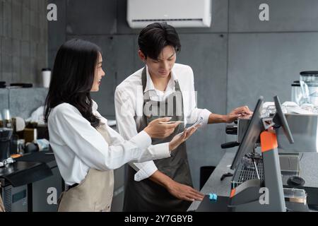 Young Entrepreneurs Collaborating in Modern Coffee Shop Startup Business Environment Stock Photo