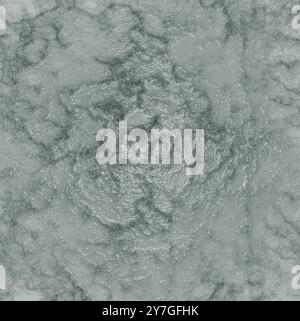 The texture of a rough surface with a wavy pattern on a gray background Stock Photo