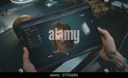 Advanced archaeological lab: Scientist studies ancient human anatomy using tablet computer. Screen shows user interface, process of scanning fossil skull through camera in 3D modeling software. VFX Stock Photo