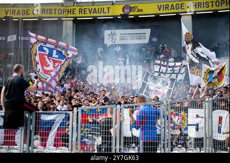 Fans of Lyon celebrating the goal during the French championship Ligue 1 football match between Toulouse FC and Olympique Lyonnais (Lyon) on 29 September 2024 at Stadium in Toulouse, France Stock Photo