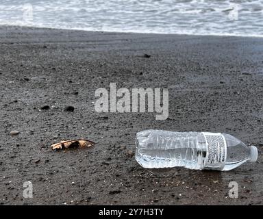 Plastic water bottle discarded along the beach Stock Photo