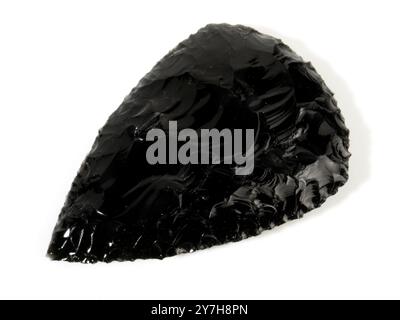 Stone Age Obsidian Hand Axe isolated on white Background Stock Photo
