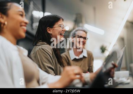 Happy businesswoman with female colleagues working at office Stock Photo