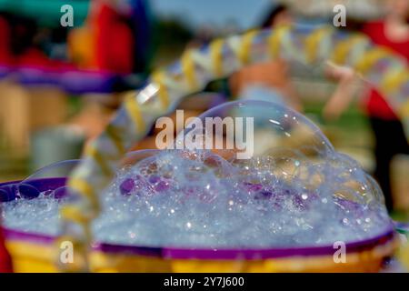 close-up of bubbles and foam, water games at a children's birthday party. soap bubble game and playful in childhood Stock Photo