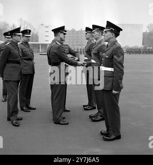 PRINCE PHILIP PRESENTS DUKE OF EDINBURGH  AWARD TO SERGEANT HEARNE D C IN LONDON /  ;  1 MARCH 1964 Stock Photo