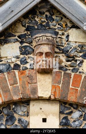 Kings head detail above doorway, Framlingham Castle,  Suffolk, England Stock Photo