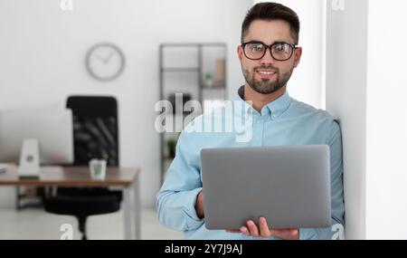 Programmer with laptop in office. Banner design Stock Photo
