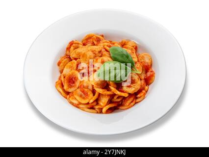 Orecchiette pasta with tomato sauce and basil leaves in white dish isolated on white with clipping path included, orecchiette typical Italian pasta fr Stock Photo