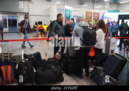 Passengers prepare to board the Villa Vie Odyssey cruise ship at Belfast Port's Cruise Ship Terminal, after the luxury cruise ship became marooned in Belfast for four months due to unexpected repair works. Picture date: Monday September 30, 2024. Stock Photo