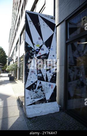 Part of the Berlin Wall in Potsdamer Platz with graffiti seen on it, the Berlin Wall was built by the East Germans in1961 to surround West Berlin Stock Photo