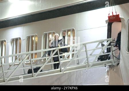 Holly Hennessey boards the Villa Vie Odyssey cruise ship at Belfast Port's Cruise Ship Terminal, after the luxury cruise ship became marooned in Belfast for four months due to unexpected repair works. Picture date: Monday September 30, 2024. Stock Photo